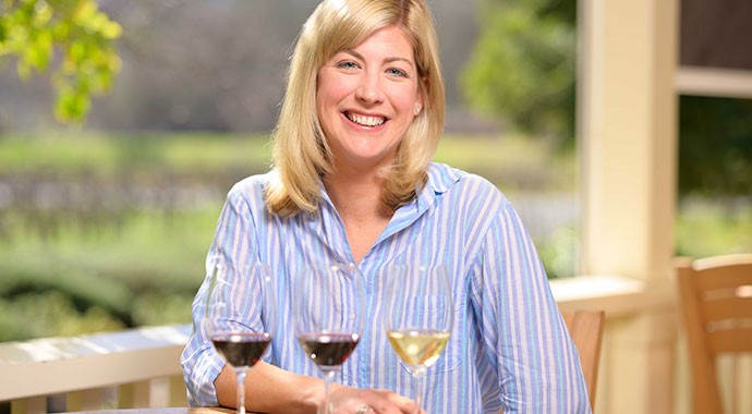 Winemaker Renee Ary walking through barrel cellar