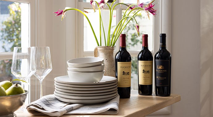 Duckhorn Vineyards wines on a table with plates