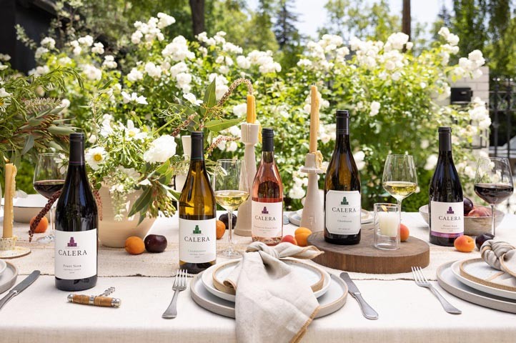 five bottles of Calera wines on dining table