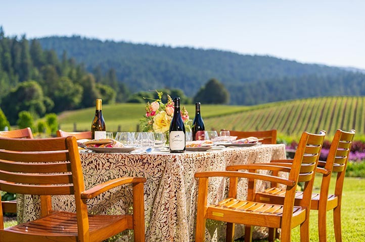 Goldeneye dining table setup with Confluence vineyard view